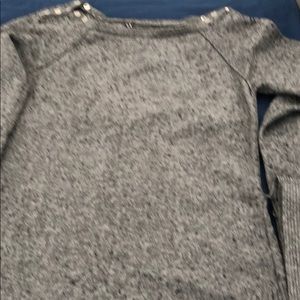 Amani Exchange Sweater silver buttons at the neck.